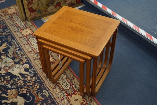 A nest of three Parker Knoll teak occasional tables, width 48cm, depth 42cm, height 49cm